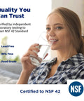 Woman drinking water certified to NSF 42, promoting Two Pack 1/4 Inch Quick Connect Refrigerator And Ice Maker Filter Cartridges Post Carbon.
