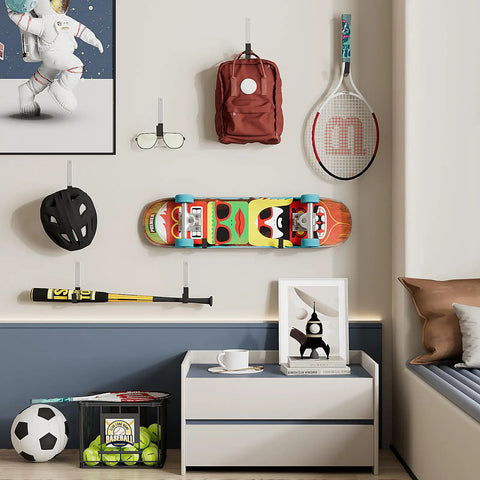Wall showcasing Heavy Duty Steel Hooks For Garage Storage And Tool Organization with items like backpack and skateboard hung on hooks.
