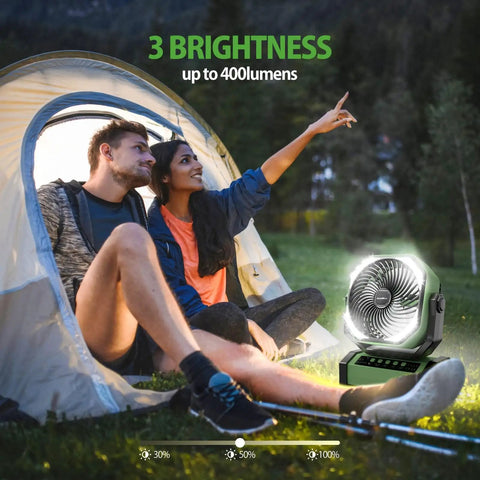 Ultra Powerful 20000mAh Camping Fan With Light And Remote Auto Oscillating Fan next to couple sitting by tent in woods