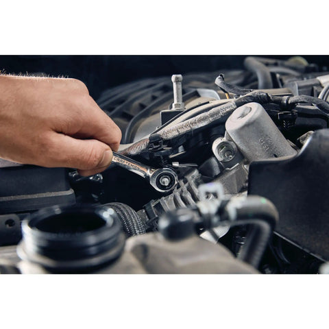 Mechanic using 7 Piece SAE Ratcheting Wrench Set With 72 Tooth Box End 15 Degree Offset Chrome Finish Quick Engagement in tight engine space