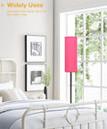 Pink Shade Floor Lamp For Living Room And Bedroom, Tall 65 Inch Standing Lamp With Black Iron Pole next to a bed