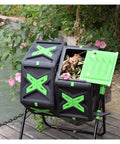 Outdoor 140L Dual Chamber Rotary Compost Bin in garden setting showing durable plastic steel construction with green and black design.