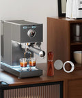 51mm Espresso Accessories Kit With WDT Tool Dosing Funnel Puck Screen Set shown with espresso machine and glasses