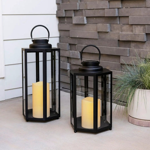 Outdoor Solar Powered Lantern With Flameless Candle For Porch Or Patio, waterproof black metal and glass, shown on patio