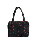 Underseat Travel Carry On Bag Built With Recycled Nylon Small Cloud Style Painted Wildflower Fits Under Airplane Seat And On Top Of Rollers Exterior Pockets For Quick Access Washable And Lightweight - Black bag with red wildflower pattern, exterior pockets, and shoulder straps