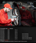 Mechanic installing Heavy Duty Rear ABS Wheel Speed Sensor Pair on Ram 2500 3500 Crew Cab Pickup in garage.