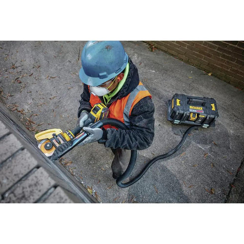 Worker using FlexVolt 60V Max Cordless Angle Grinder With Kickback Brake, 4-1/2 To 6 Inch, Tool Only, 9000 RPM on metal surface