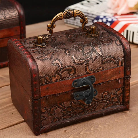 Vintage box with Two Pack Antique Black Hasp Latches With Alloy Swing Arm Clasp for chests, matte black finish, on wooden table.
