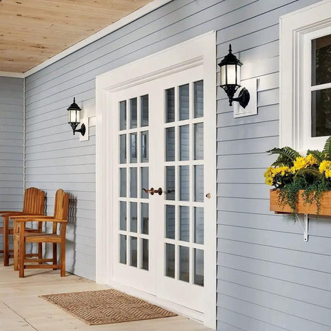 Coastal White Outdoor Wall Light With Clear Beveled Glass 17 Inch Tall 1 Light Exterior Porch Lantern Traditional Lantern Sconce For Curb Appeal And Warm Welcome on blue siding near French doors