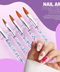 All-In-One Nail Art Tools Kit With 23 Pcs Brushes 5 paintbrushes with pink handles on clear stand displaying colorful nail art