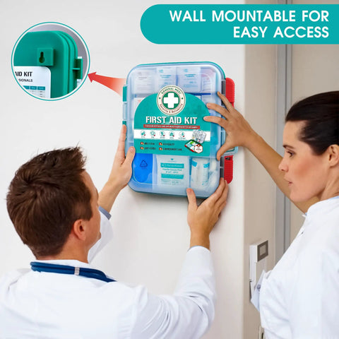 Two people mounting a 420 Piece Pro First Aid Kit In A Sturdy Hard Case with medical supplies on a wall.