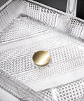 Close-up of Square Clear Glass Vessel Sink Slick Finish Zero Hassle Cleanup Bathroom Vanity Basin showing textured surface and copper stopper.