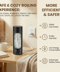 Slick Compact Travel Electric Kettle One Twenty Volt With Adjustable Temp Settings Fast Boil Portable Hot Water Maker on a table next to a cup.