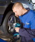 Mechanic using 20V 1/2 Inch Brushless Cordless Impact Wrench Kit With 4 Speed Control on car wheel