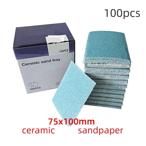 Versatile 75x100mm Ceramic Square Sandpaper Sheets For Car Putty Sanding Fine Polishing Abrasive Grids Cut To Size Perfect For Woodworking Plaster Finishing And Paint Stripping 50 Or 100 Pack Of Durable Grit Pads in a box, with 75x100mm sheets stacked.