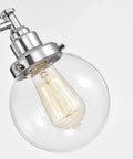 Close-up of globe glass on Four Light Chrome Bath Vanity Fixture With Globe Glass Uplight And Downlight 30 Inch Wide Hardwired