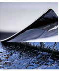 Close-up of Heavy Duty Flashing Tape For Roofs Hella Waterproof Aluminum Foil showing adhesive layer and smooth surface.