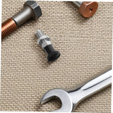 Close-up of Stainless Steel Spring Indexing Plunger with Fast Reset Mechanism, surrounded by tools, ideal for heavy machinery use.