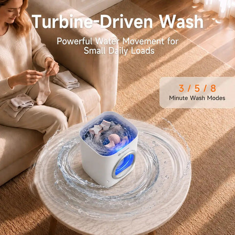 Slim Portable Mini Washer That Crushes Small Loads Without The Hassle A Real Game Changer For Dorm Life And Weekend Trips With Snappy USB C Charge on a table with water movement.
