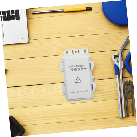 Heavy Duty Waterproof Junction Box For Outdoor Electrical Circuits With UV Resistant Plastic Enclosure on wooden surface.