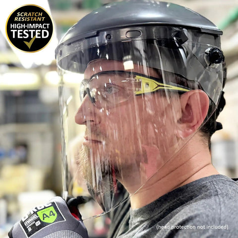 Premium Lightweight Frameless Safety Glasses with Killer Antifog Lens and Rock Solid Comfort for Marathon Shifts Bulk Box Includes 144 Pairs Green Gray Wraparound Shield Protection for Construction Crews worn by a worker in a shop.