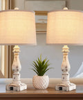 Touch Control Rustic Table Lamps Set of 2 with Dual USB Ports 3 Way Dimmable Vintage Bedside Lamps Antique White Resin Finish Linen Shade Perfect for Bedroom and Living Room Includes 2 Bulbs on a table