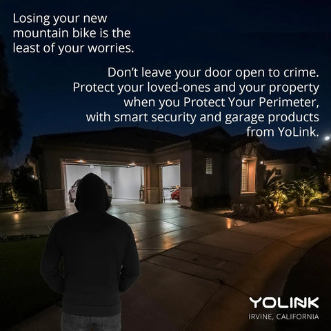 Person in hoodie at night outside home with open garage, highlighting security need for Worlds Longest Range Garage Door Controller And Wireless Sensor Kit For Your Existing Opener LoRa Remote Control Works With Alexa And IFTTT Hub Required