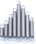 5 Piece 0.5mm Wire Diameter 3Mm Outer Dia 15 To 120Mm Length Stainless Steel Extension Springs arranged in a triangular shape.