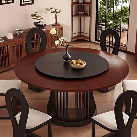 Top Tier Sintered Stone Lazy Susan Turntable Featuring A Smooth Operator 360 Degree Quiet Spin For Effortless Serving Heavy Duty Kitchen Centerpiece In Sleek Black on a wooden dining table.