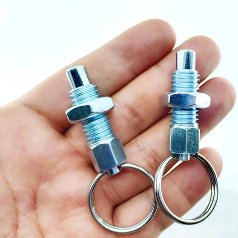 Heavy Duty Four Pack Carbon Steel Spring Plunger With Pull Ring M10x1.5 Retractable Indexing Pin in hand, showing pull rings.