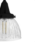 Close-up of clear holophane glass shade on Cypress Grove 4 Light Natural Black Iron Vanity Light With Clear Holophane Glass Shade, Medium Size