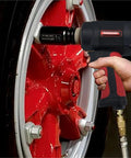Heavy Duty 1/2 Inch Air Impact Wrench Pumping Out Badass Torque With Rock Solid Ergonomic Handle And Sweet Compact Mini Body in action on a red wheel.