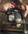 Heavy Hitter 13 Amp 7 1/4 Inch Corded Circular Saw In Bright Red cutting wood with precise, smooth rip cuts in workshop.