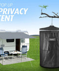 Pop Up Privacy Tent For Camping And Emergencies, portable tent set up near trailer with outdoor chairs and table