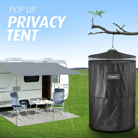 Pop Up Privacy Tent For Camping And Emergencies, portable tent set up near trailer with outdoor chairs and table