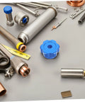 Blue Alloy Valve Stem Knob With 6mm Hole Replacement amidst plumbing tools on gray surface