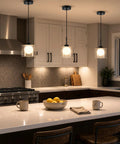 Karjearl Glass Pendant Lights Kitchen Island, 2 Pack Black Hanging Lighting in modern kitchen with quartz countertop.