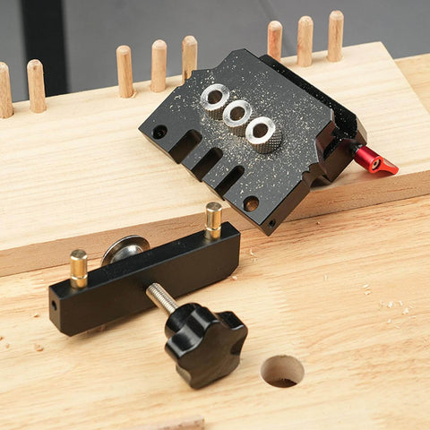 Self Centering Doweling Jig Kit With Aluminum Alloy Construction Including 3 Drill Bits For Pro Grade Furniture Assembly And Wood Joinery Projects, Precision Alignment And Zero Deflection Center Block on wooden surface.