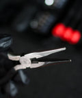 Close-up of pliers from Tri Fold Mini Tool Set For Dorm Room And Travel 25 Piece Pocket Home Repair Kit