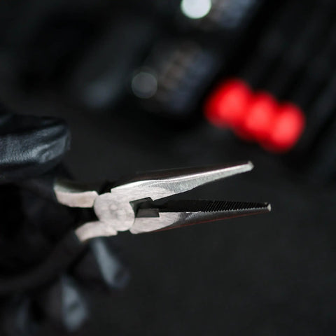 Close-up of pliers from Tri Fold Mini Tool Set For Dorm Room And Travel 25 Piece Pocket Home Repair Kit