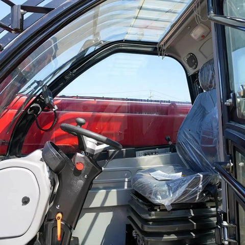 Interior view of Versatile Telescopic Handler With Quick Attach System And Enclosed Brake For Warehouses Farms Or Industrial Job Sites. Steering and seat.
