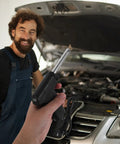 Portable welding bumper car kit tool in hand for auto repair; ergonomic design for fixing plastic and metal parts.