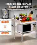 Stainless Steel Grill Stand Table 24 By 28 By 26 Inches With Adjustable Undershelf Built Tough For Home Kitchen Restaurant And Hotel Use Commercial Grade Work Table, showing a microwave and cutting board with vegetables.