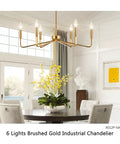 Six Light Modern Brushed Brass Chandelier 26 Inch Hanging Ceiling Light Fixture For Living Room Dining Room And Kitchen Island Industrial Candle Style Dope Tubular Design in a dining area.