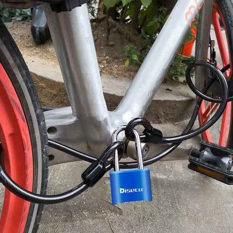 Built Tough 4 Digit Combination Padlock With 2.5 Inch Shackle, Outdoor Waterproof Lock For School Gym Locker, Storage Unit, Fence, Gate And Toolbox Blue, Resettable And Dustproof With Clear Large Digits For Easy Locking securing a bicycle on a street.