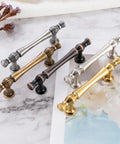 10 Pack 3 Inch Hole Centers Antique Brass Cabinet Pulls Vintage Brass Cabinet Hardware in various finishes on marble surface