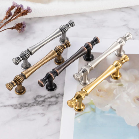10 Pack 3 Inch Hole Centers Antique Brass Cabinet Pulls Vintage Brass Cabinet Hardware in various finishes on marble surface