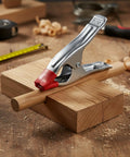 Heavy Duty A-Clamp Locking Pliers Made From Durable Alloy Steel gripping cylindrical wood on a workbench during assembly.