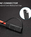 Close-up of Beefy 10AWG SAE Solar Connector Cable Set with waterproof cap on textured surface