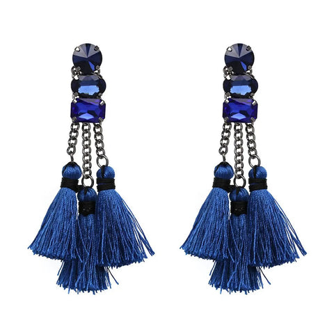 Pair of blue tassel earrings with blue stone embellishments and chain details